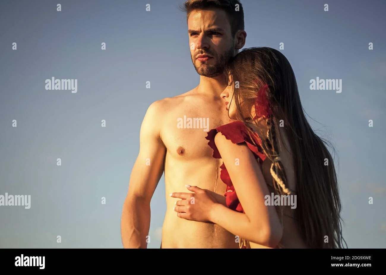Wild desire. Sex games concept. Wild passion. Passion between us. Sexy couple in love. Girl in leather clothes and fit muscular man with bare torso. Summer